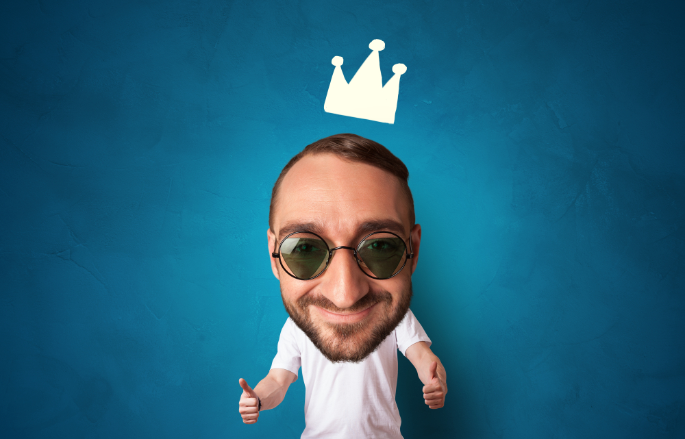 Funny person with big head and drawn crown